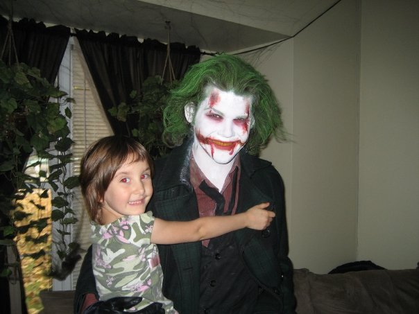 Me and my good friend's kid.  She really got a kick out of me showing up to her and her family's door on Halloween! (Makeup based loosely on Lee Bermejo's rendition of the Joker)